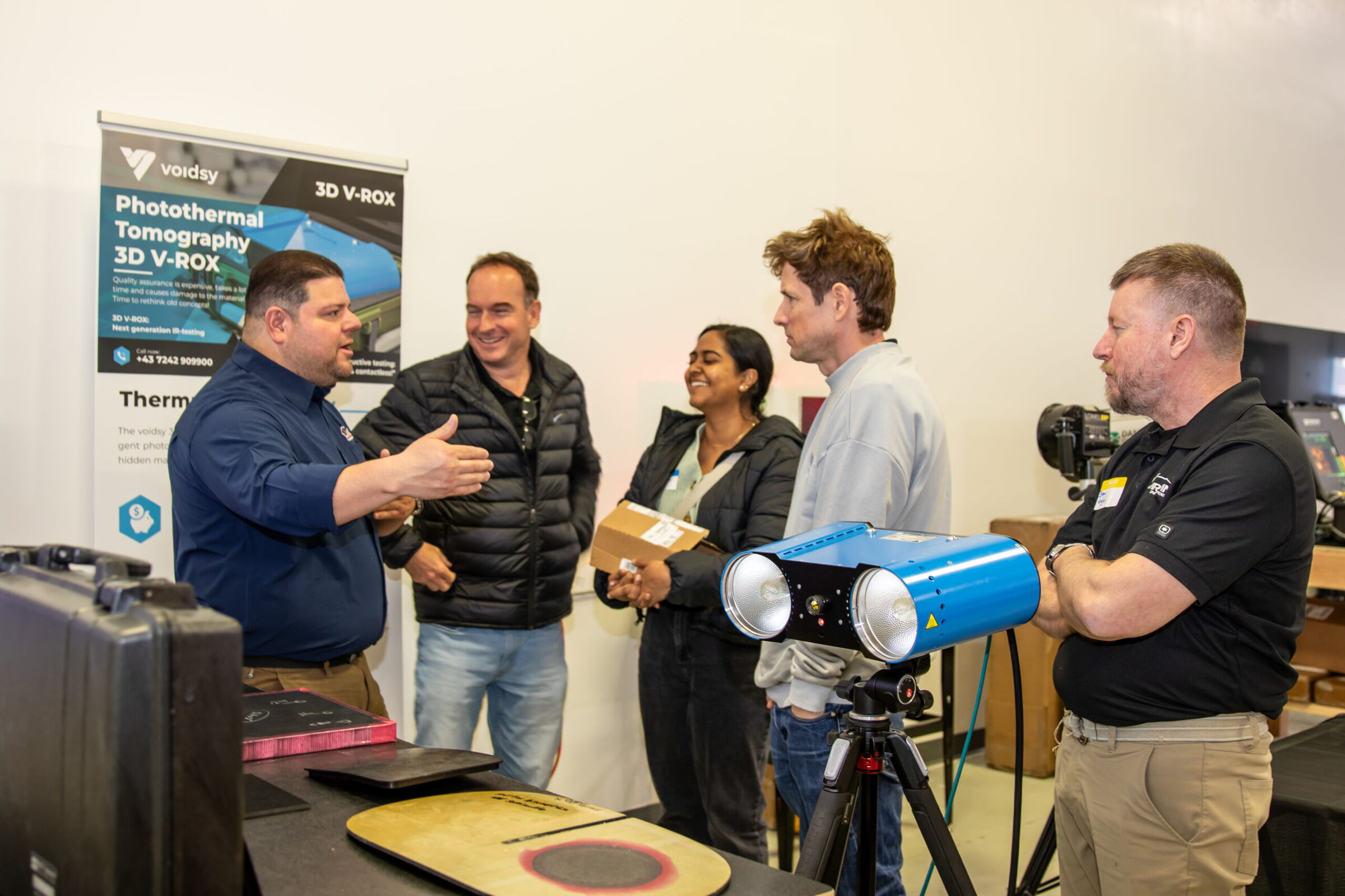Oscar Balandaran demonstrates the Voidsy photothermal tomography 3D V-ROX system during the AIMM Center Open House.