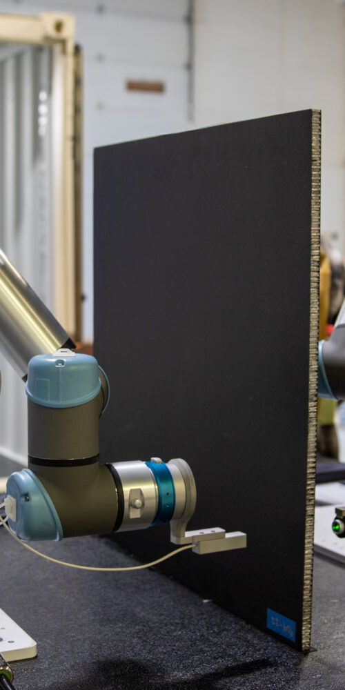 OMNI NDE collaborative robot (cobot) performing non-destructive inspection on a composite part using CICNDT techniques at the AIMM Center in Ogden, Utah.