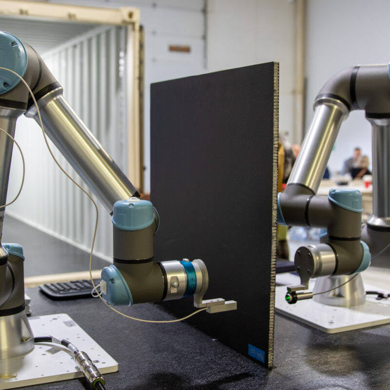 OMNI NDE collaborative robot (cobot) performing non-destructive inspection on a composite part using CICNDT techniques at the AIMM Center in Ogden, Utah.