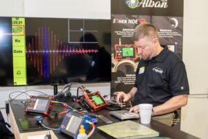 Technician uses NDT equipment to assess bond integrity of aerospace components at the AIMM Center in Ogden, Utah.
