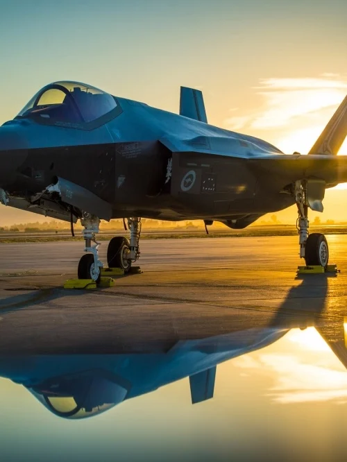 -35 fighter jet at sunrise representing Photothermal Radiometry in aerospace inspection